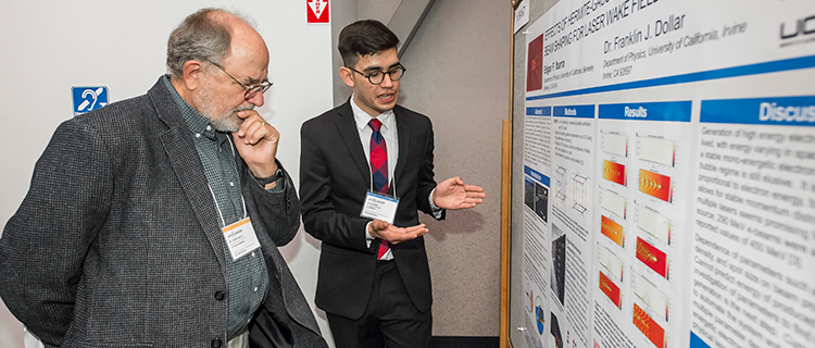  Scholars engage with faculty judges and fellow scholars as they present their research at the 2018 UC LEADS Symposium at UCSB